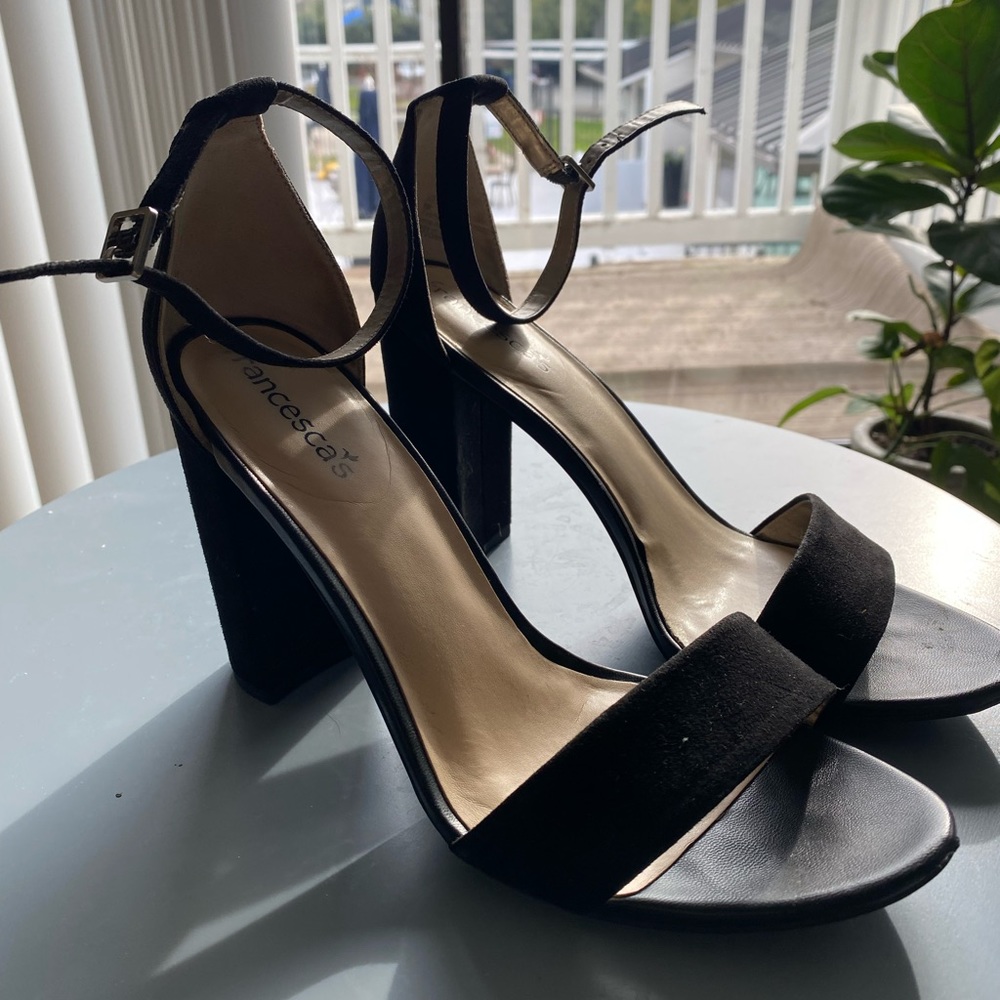 Platform black heels with a strap and buckle
